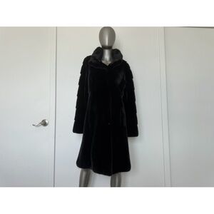 Luxurious black fur coat made of natural mink fur.